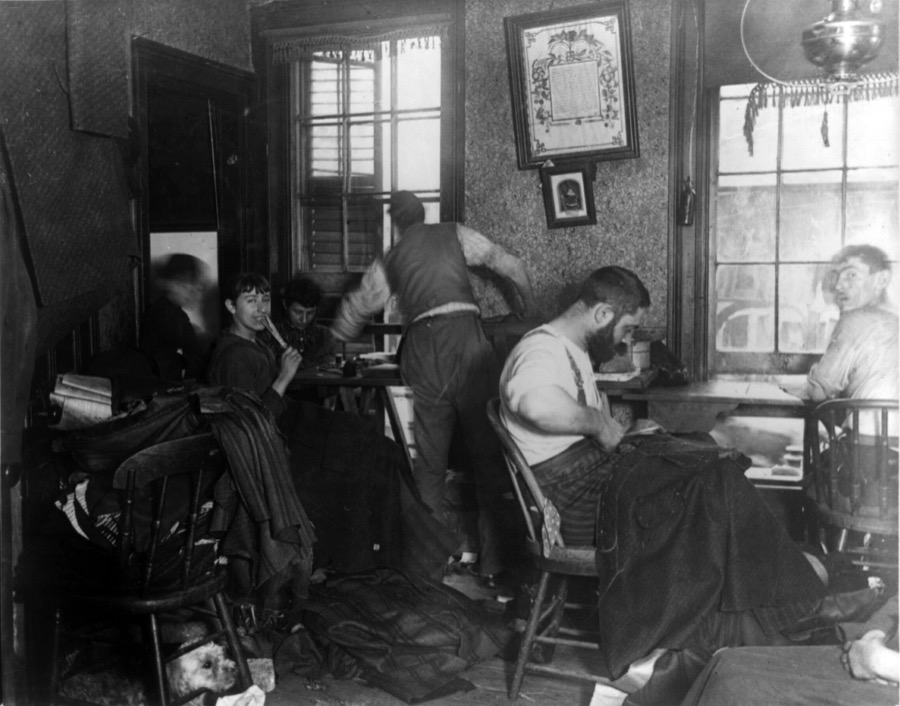 Workers in a Ludlow Street tenement sweatshop, New York City, circa 1889